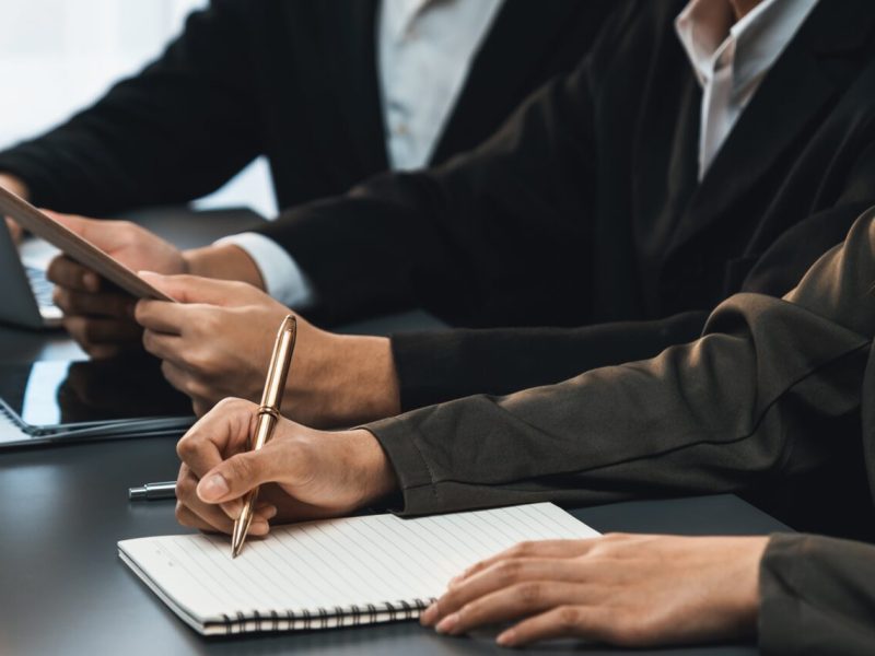 Candidate and interviewers discuss work experience and qualifications in friendly job interview at corporate office. HR team evaluates job application while interviewee explaining profile. Prodigy